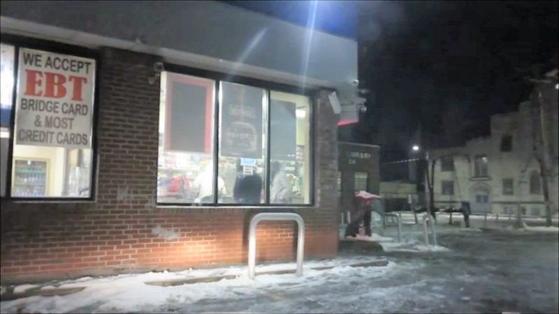 INSIDE A GHETTO GAS STATION AT NIGHT ON DETROITS EAST